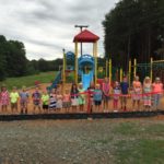 Playground opening, smiling kids, commercial playground equipment